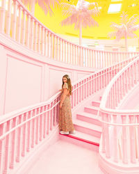 Woman standing on staircase