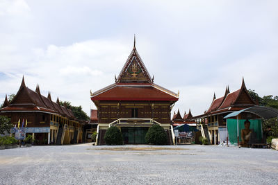 Temple outside building against sky in city