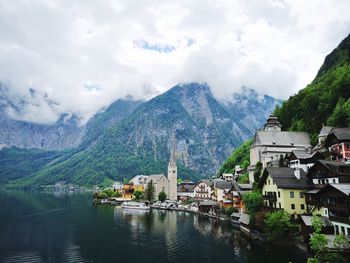 Panoramic view of buildings and mountains against sky