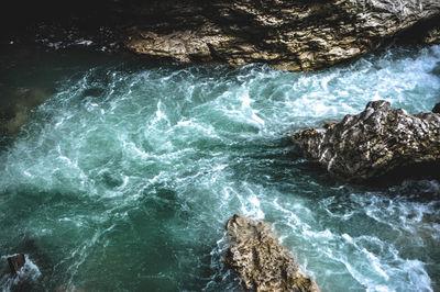 High angle view of rocks in sea