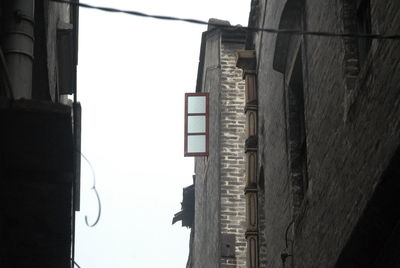 Low angle view of buildings against clear sky