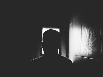 Silhouette man at home