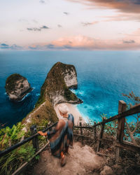 Man looking at sea against sky