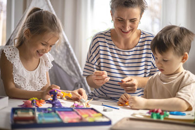 Mother painting at home