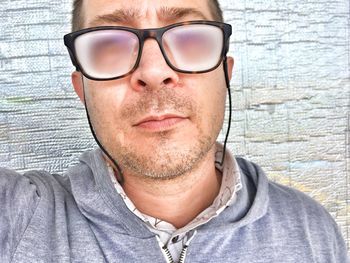 Close-up portrait of young man wearing eyeglasses