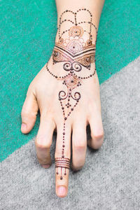 Close-up of woman hand with tattoo