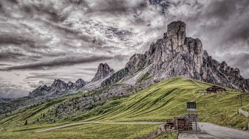 Scenic view of mountain against cloudy sky