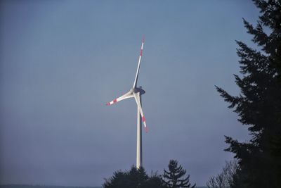 Low angle view of wind turbine against sky