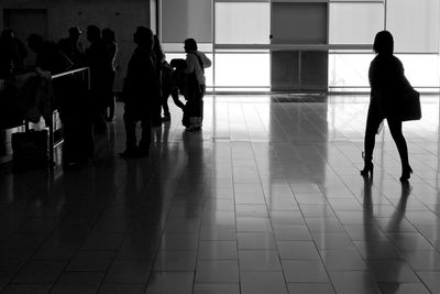 Full length of woman standing on floor