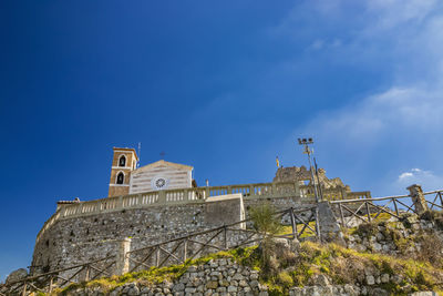 Low angle view of building against blue sky