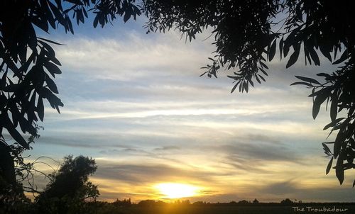 Low angle view of cloudy sky at sunset
