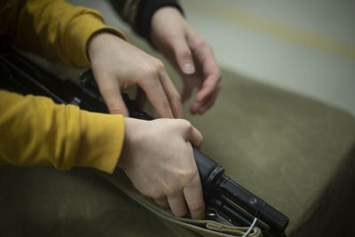 Cropped hands of man working at home