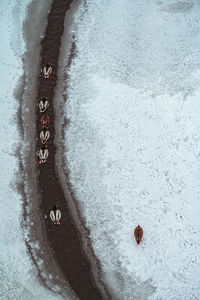 High angle view of snow on sea