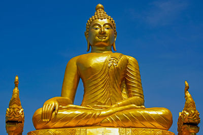 Golden buddha statue on phuket, thailand