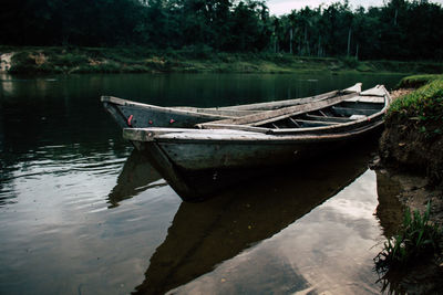 Boat moored in lake