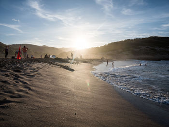 Panoramic view of beach against sky during sunset