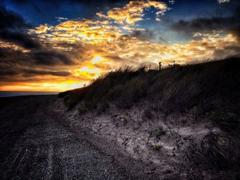 Scenic view of dramatic sky during sunset