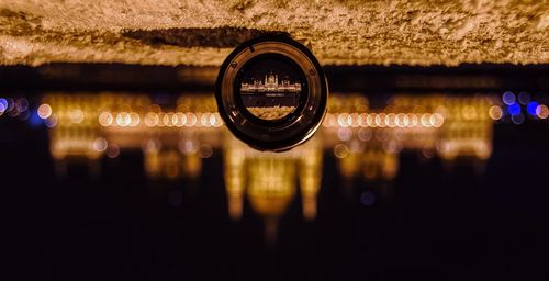 Upside down view of hungarian parliament through lens