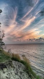 Scenic view of sea against cloudy sky