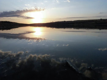 Scenic view of sunset over water