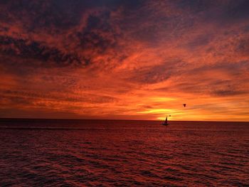 Scenic view of dramatic sky over sea during sunset