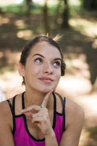 Portrait of woman holding purple outdoors