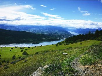 Scenic view of mountains against cloudy sky