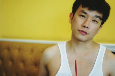 Portrait of man wearing tank top indoors