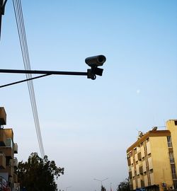 Low angle view of street light against sky