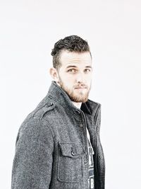 Young man against white background