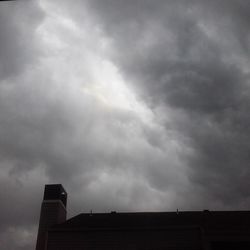 High section of building against cloudy sky