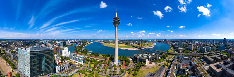 High angle view of buildings against cloudy sky