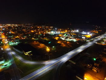 High angle view of illuminated cityscape at night