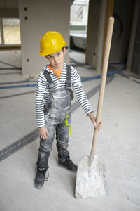 Rear view of man working at construction site