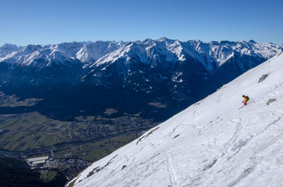 Woman standing on snow covered landscape