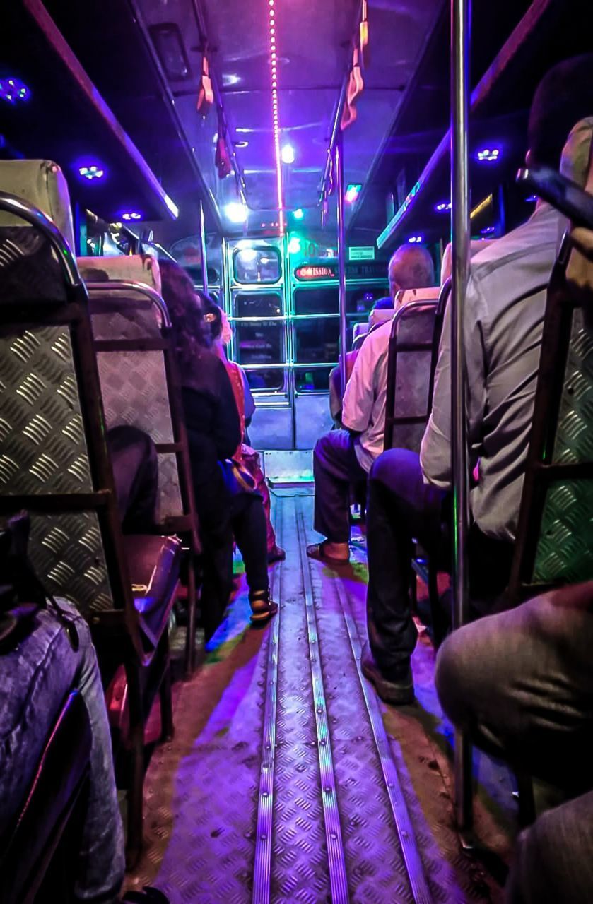 GROUP OF PEOPLE IN TRAIN AT NIGHT