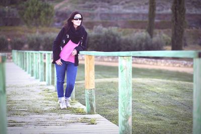 Full length of woman standing in park