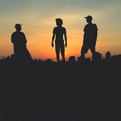Silhouette of people at sunset