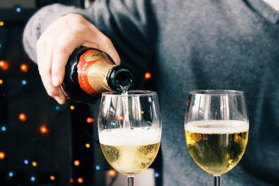 Close-up of hand holding wineglass