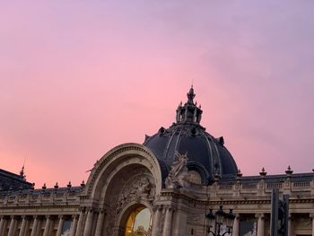 Low angle view of building against sky during sunset