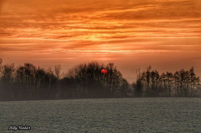Scenic view of landscape against sky during sunset