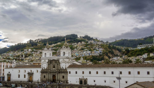 Buildings in city against sky