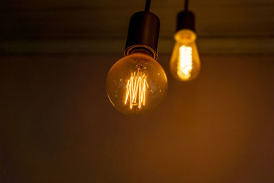 Close-up of illuminated light bulb