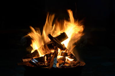 Close-up of campfire burning at night