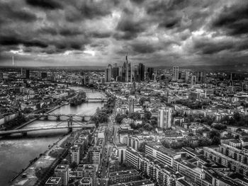 Cityscape against cloudy sky