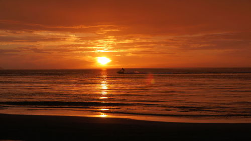 Scenic view of sea at sunset