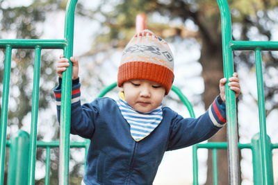 Front view of cute boy at playground