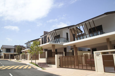 Exterior of building by street against sky