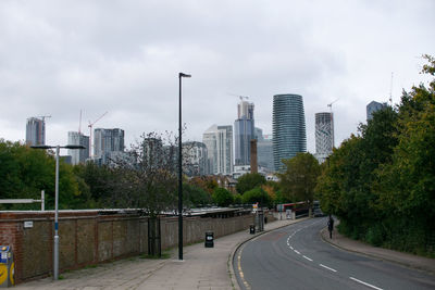 Street amidst buildings against sky