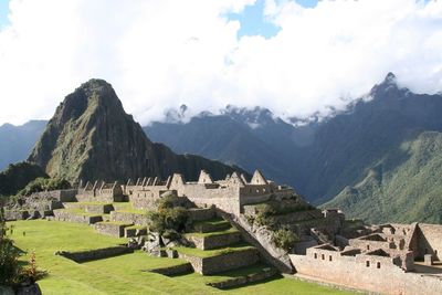 Scenic view of mountains against cloudy sky